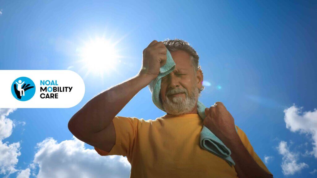 Un anziano accaldato si asciuga la fronte con un asciugamano